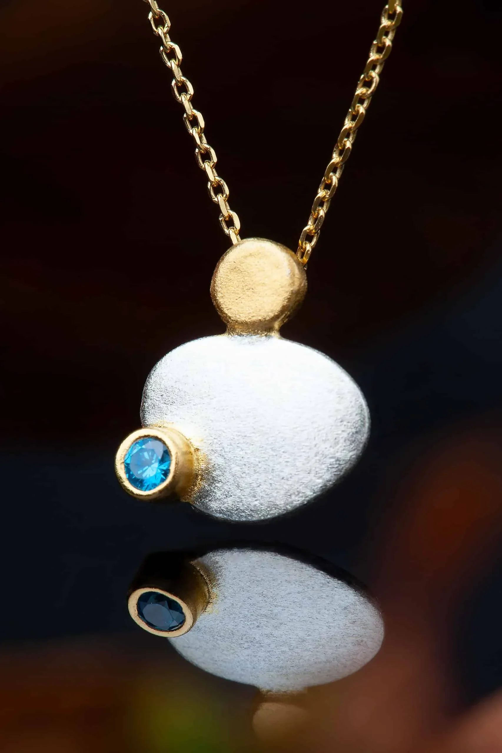 Handmade Jewellery | Round silver necklace with blue zircon gallery 1