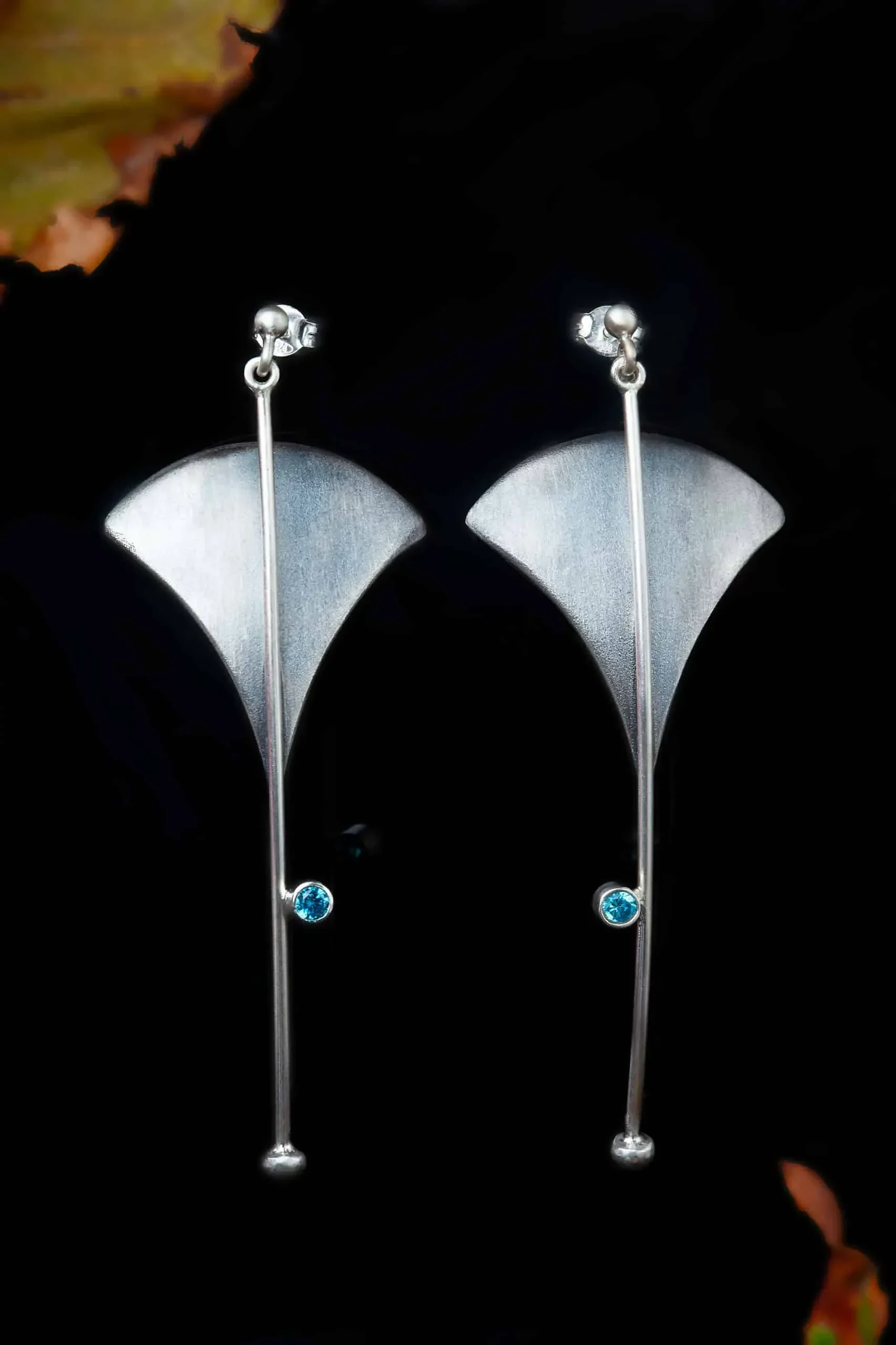 Handmade Jewellery | Triangle silver earrings with blue zircon gallery 2