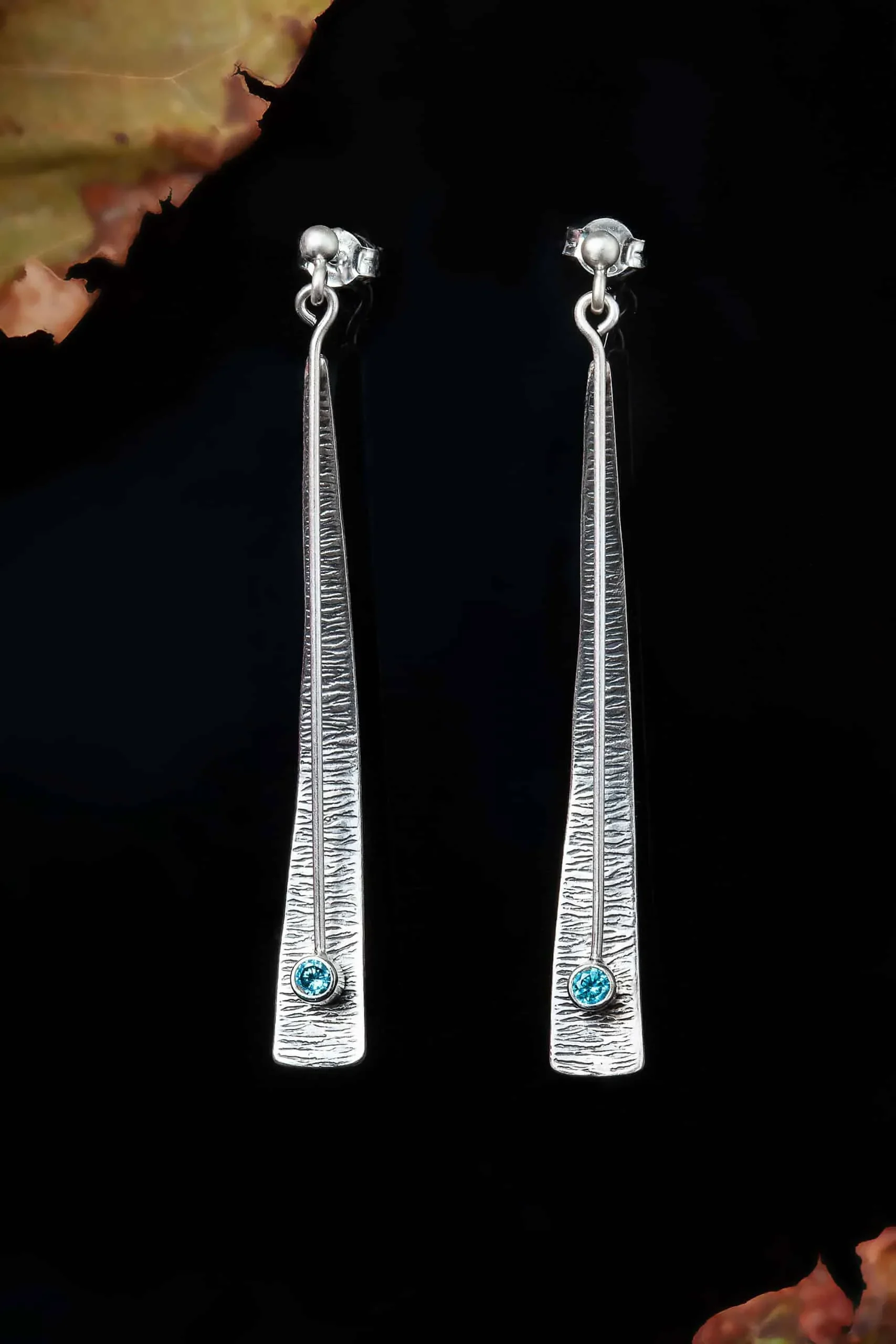 Handmade Jewellery | Triangle silver earrings with blue zircon gallery 1