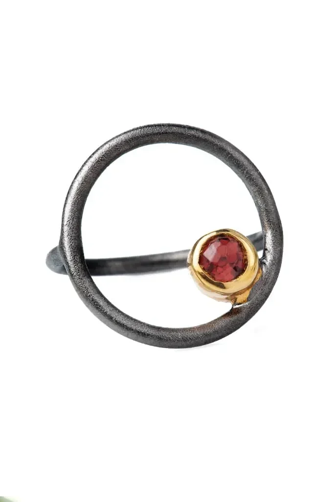 Handmade Jewellery | Round black rhodium plated silver ring with garnet main