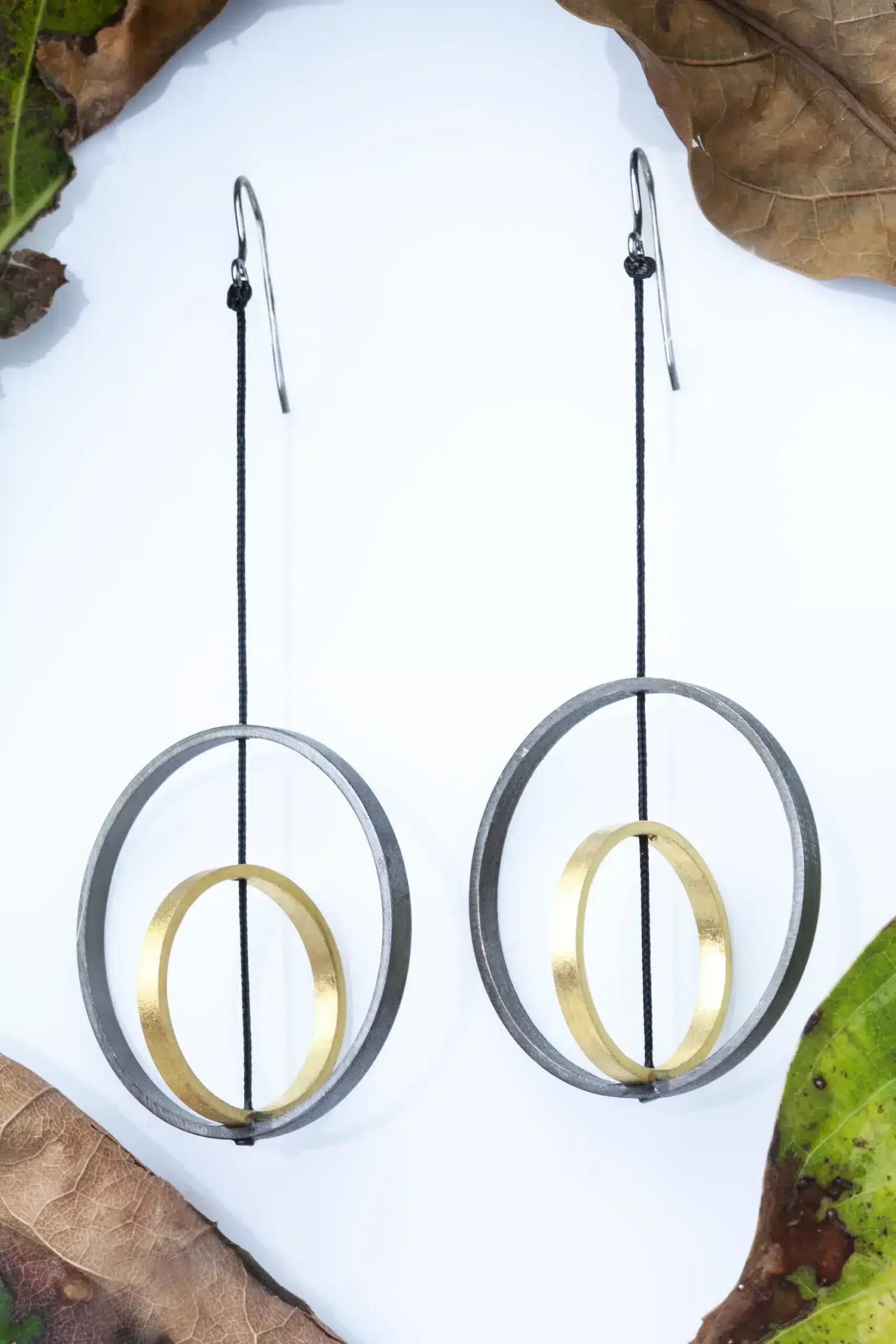 Handmade Jewellery | Bronze earrings, gold plated with black rhodium detail and silver hooks main