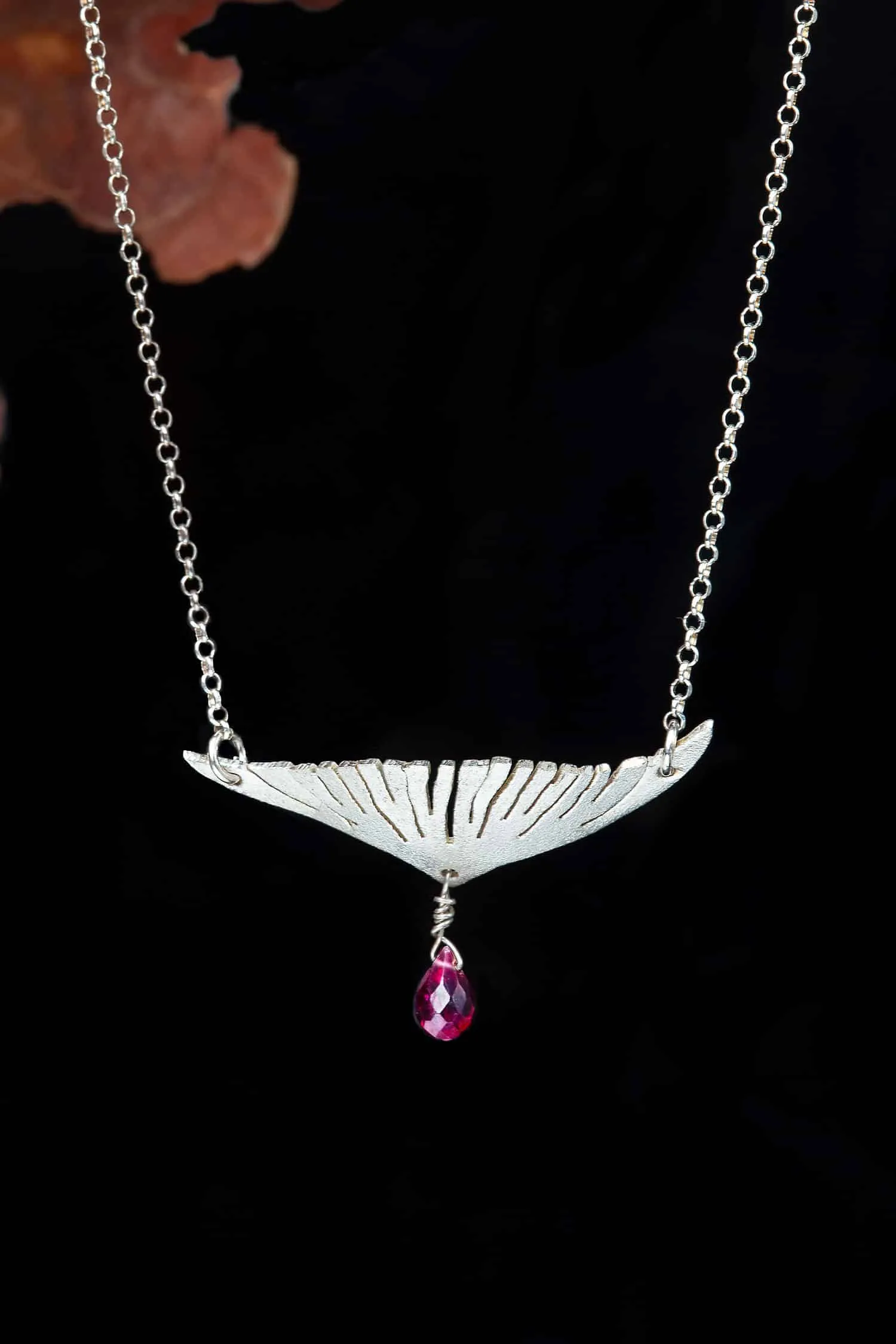 Handmade Jewellery | Wing rhodium plated silver necklace with garnet gallery 1