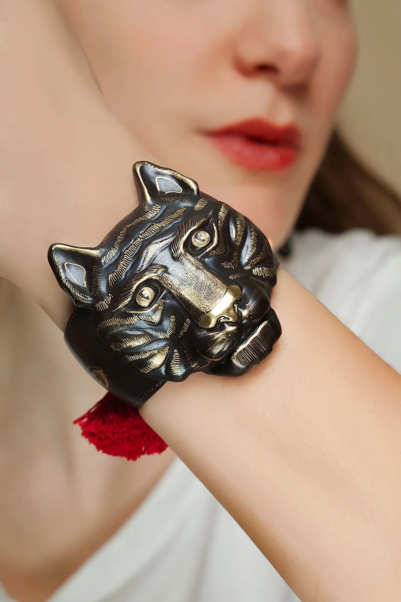 Handmade Jewellery | Tiger handmade engraved bronze bracelet with red tassels gallery 1