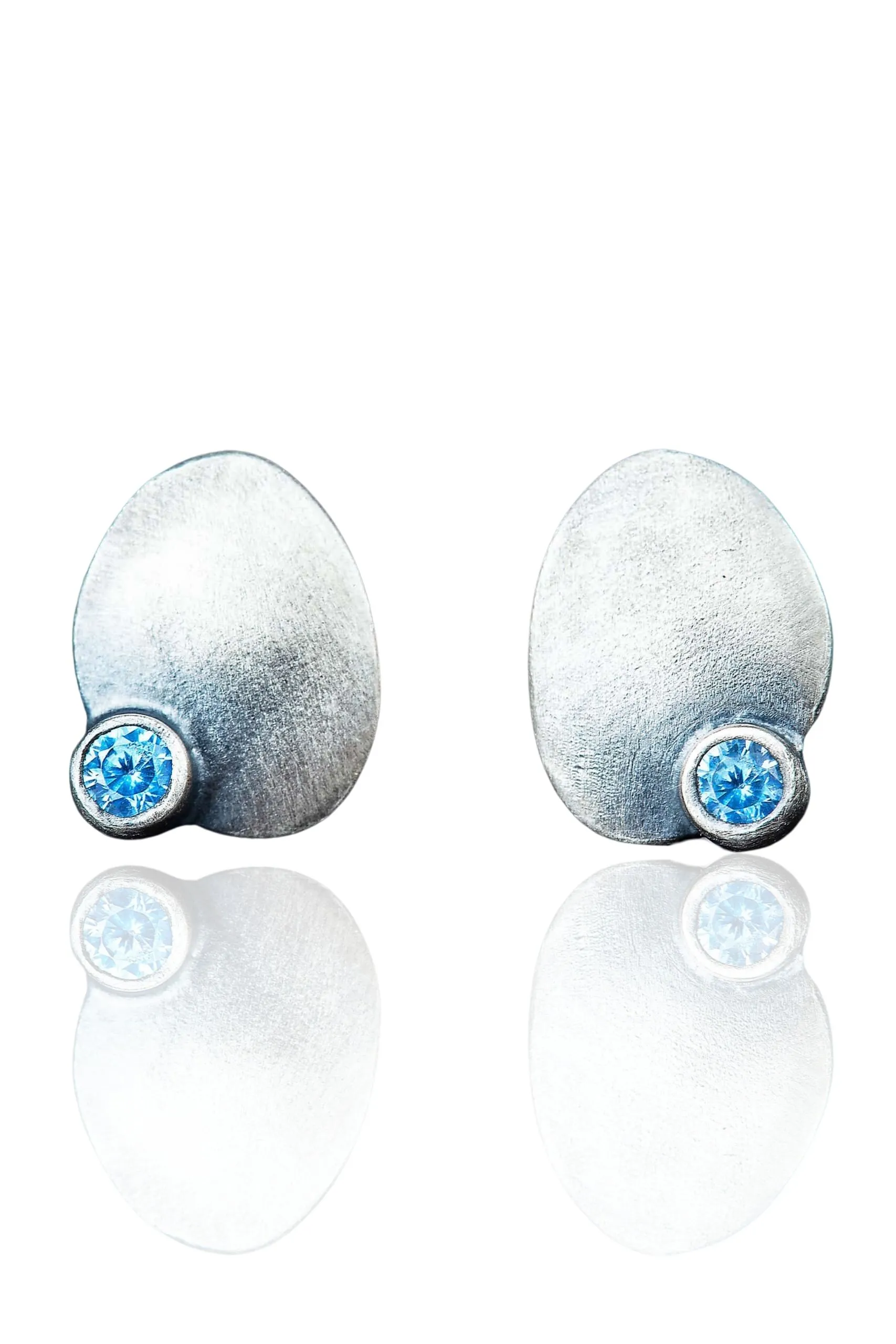 Oval silver stud earrings with blue zircon